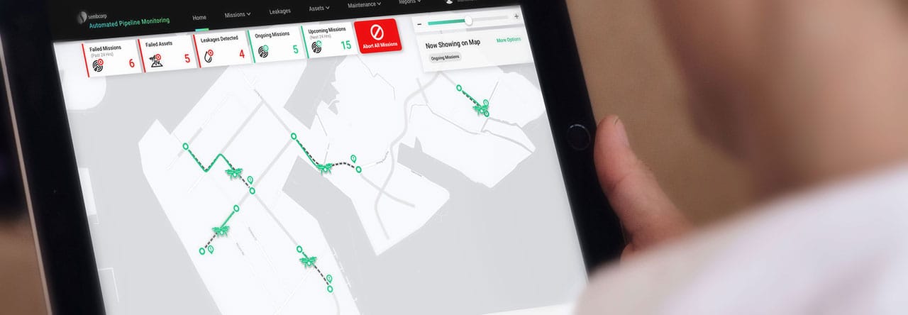 Man holding tablet with drone app on screen